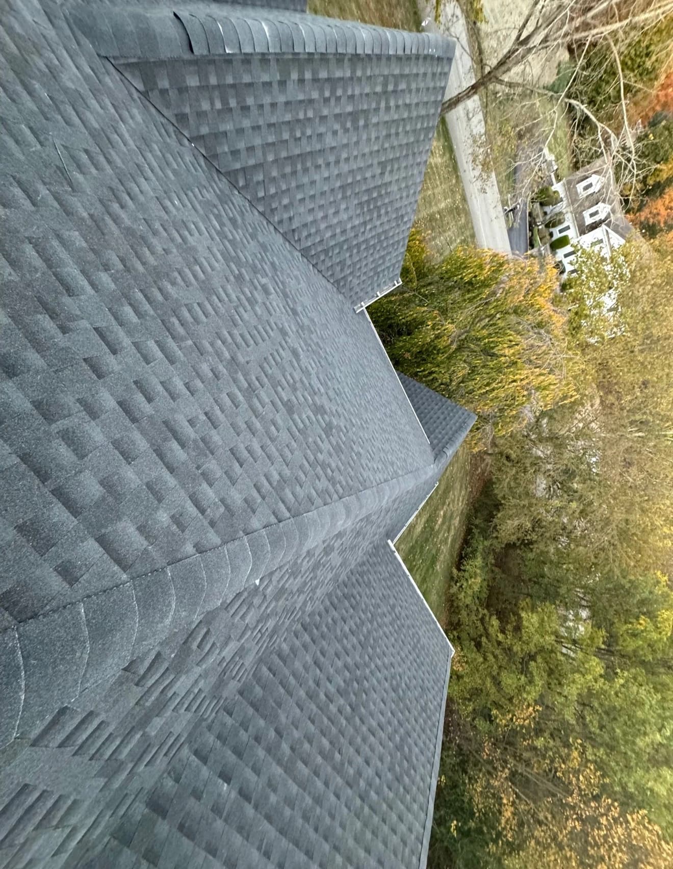 Close up of precision roof repair and architectural shingle work